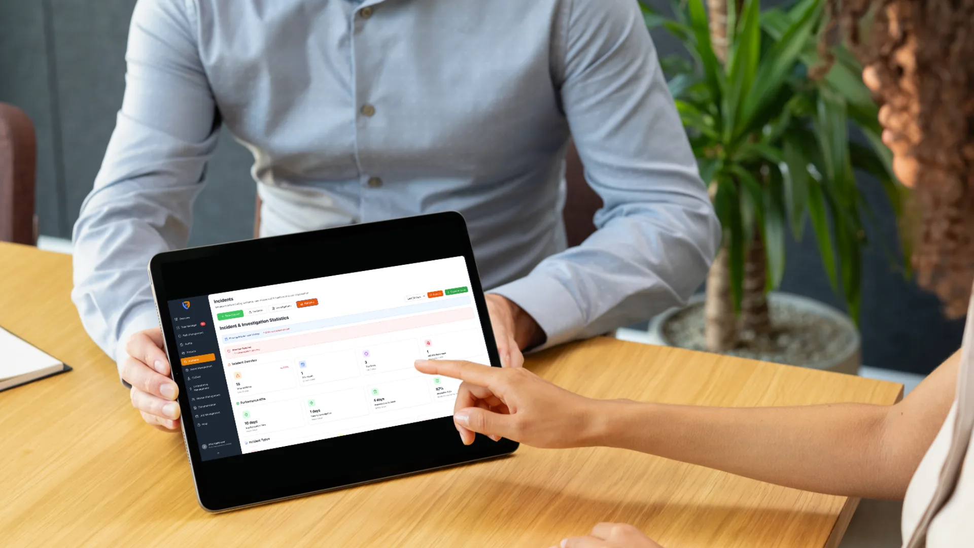 Reviewing incident and investigation statistics on a tablet in Safety Mate®